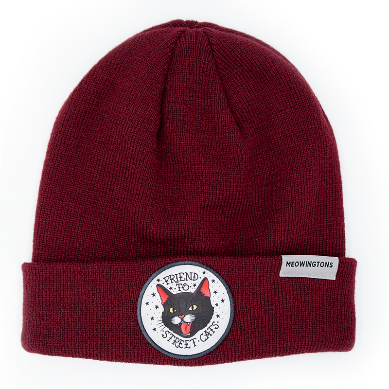 Friend to Street Cats Beanie in Purrfect Plum Burgundy. This burgundy cat beanie hat features a snarling black cat patch on the fold-over cuff with text that reads "Friend to Street Cats."