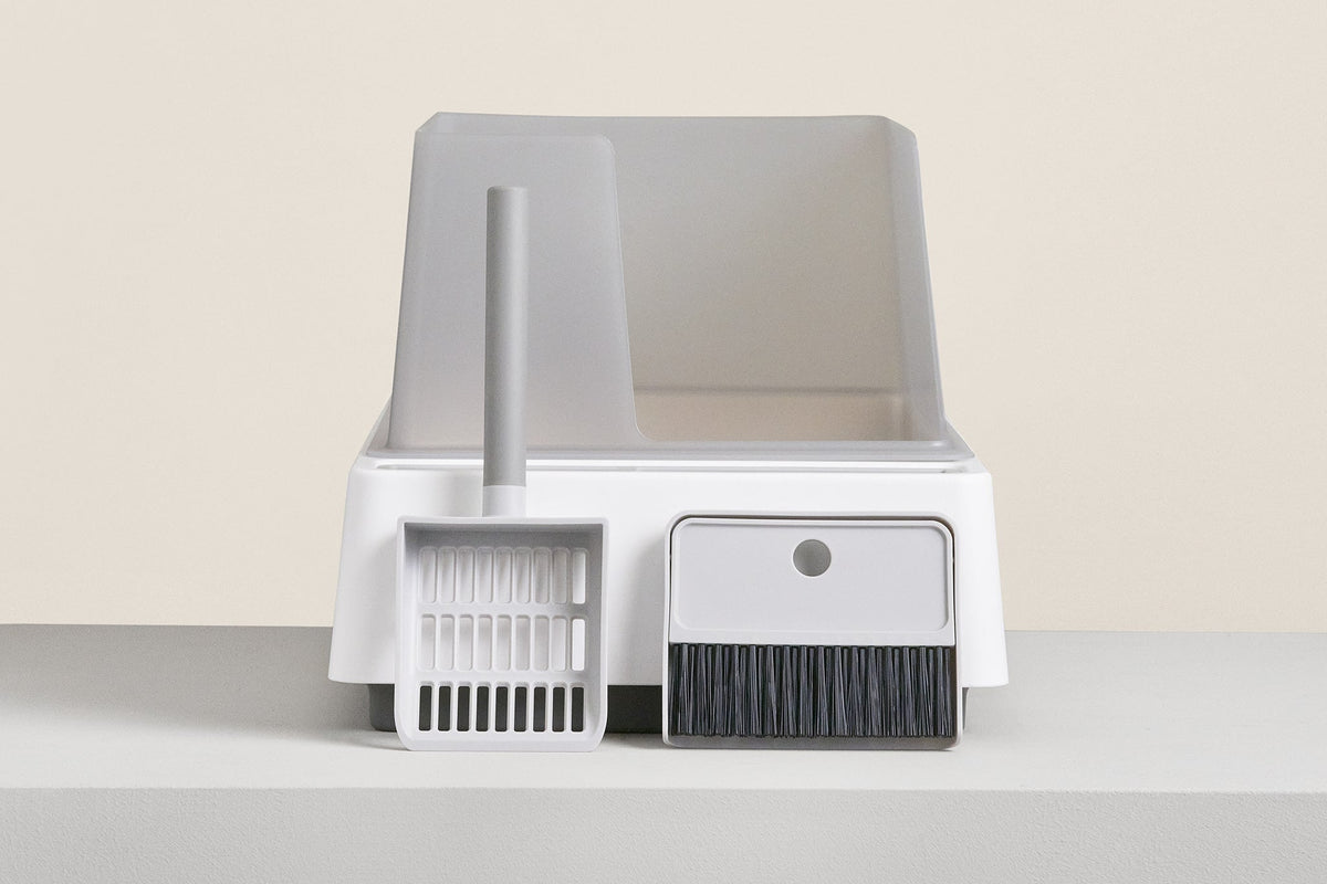 Tuft and Paw Cove litter box with integrated tools