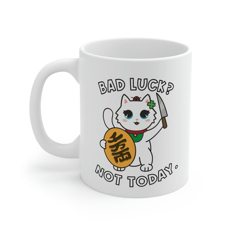 A coffee mug with a Maneki Neko Millie the Cat with the text: Bad Luck? Not today.