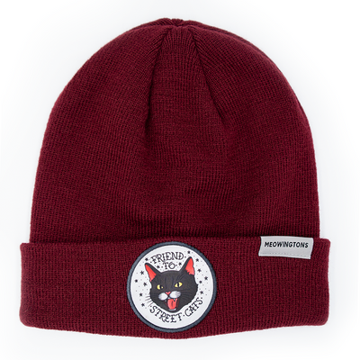 Friend to Street Cats Beanie in Purrfect Plum Burgundy. This burgundy cat beanie hat features a snarling black cat patch on the fold-over cuff with text that reads "Friend to Street Cats."